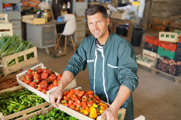 Portrait of happy armer selling products directly fom the farm