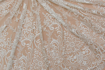 Texture lace fabric. lace on white background studio. thin fabric made of yarn or thread. a...