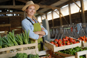 Cheerful farmer woman selling products directly fom the farm