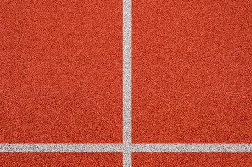 Top view of the running track rubber lanes cover texture with white line marking for background.