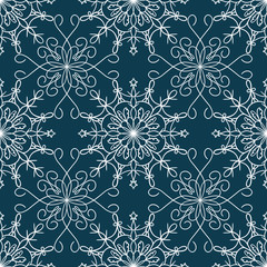 Tender winter seamless pattern with graphic snowflakes in blue and white colors