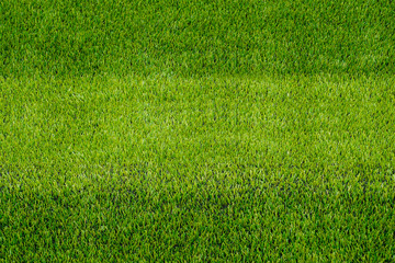 The detail of artificial green grass soccer field for backgroud