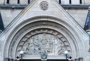 Typanum above entrance to basilica of St John the Baptist, Roman Catholic cathedral, Neu-kolln, Berlin