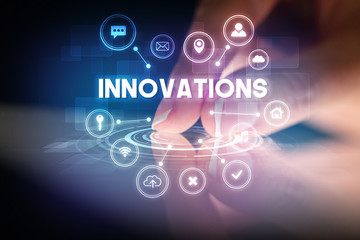 Finger touching tablet with web technology icons and INNOVATIONS inscription, web technology concept