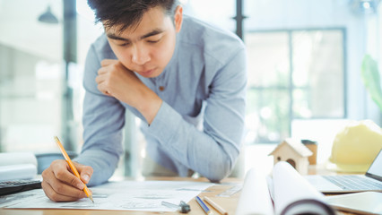 Architect or engineer working in office