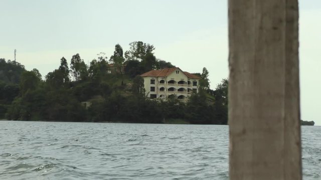 Beautiful island on lake Kivu with buildings at a boat trip during Rwanda travel in Africa