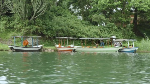 Local people are busy in a little African harbour on lake Kivu
