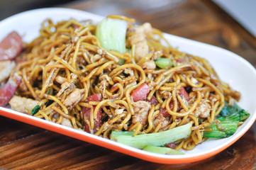 stir-fried noodles with pork, sausage and vegetable