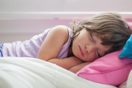 A little girl taking a nap