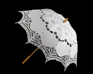 Lace umbrella on black background