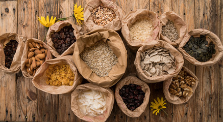 Mix of cereals and porridge, nuts and seeds for breakfast. Top view. Bio healthy nutrition products