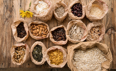 Breakfast cereals and porridge, nuts and seeds. Top view. Bio healthy nutrition products. Organic shop offer