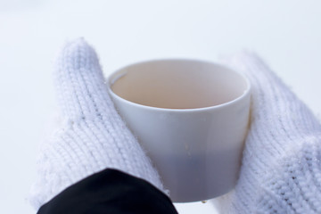 Fototapeta na wymiar Hot Cup of tea in the cold. New year mood.
