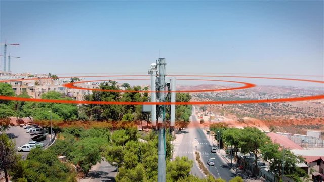 Aerial footage of Celular antenna Emitting Radiation and radio waves Visualization of radio waves coming from a Celular antenna Populated  neighborhood emitting radio signals in concentric circles