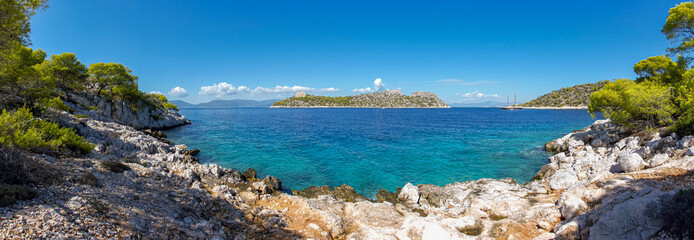 Summer sunny day beautiful view from the coast of Agistri island to the Dorousa island, Aponissos...