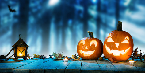 Spooky halloween pumpkins in forest