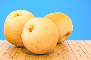 Chinese pears Nashi close-up 3d rendering with realistic texture on the wooden table