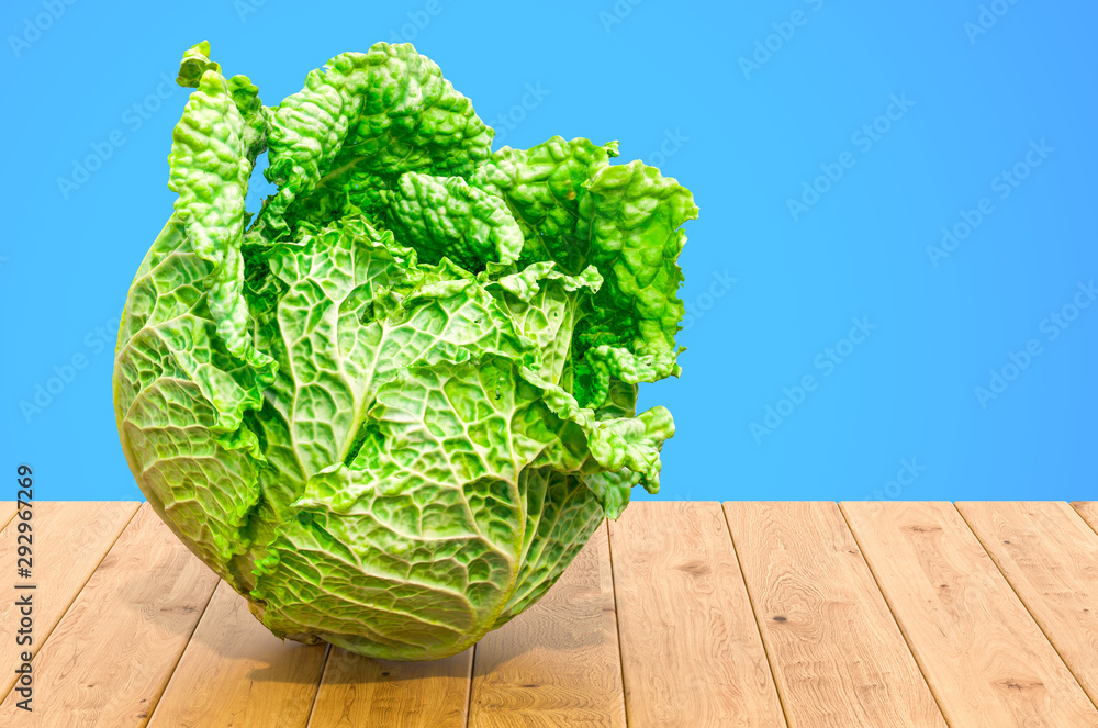 Poster savoy cabbage 3d rendering with realistic texture on the wooden table