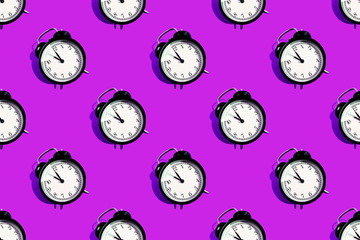 Many black classic style alarm clock with hard shadow isolated on purple background. Smile time concept. Startup pattern