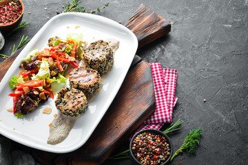 Baked veal medallions with sesame and vegetables. Dishes, food. Top view. Free space for your text.