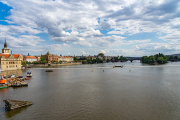 Scenic panorama cityscape view of Moldava river boat Prague in Czech Republic.