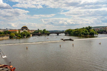 Scenic panorama cityscape view of Moldava river boat Prague in Czech Republic.