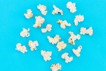 Popcorn pattern on blue  background. Top view
