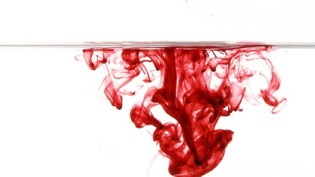Traces of red ink drifting through water. Makes for an interesting conceptual background.