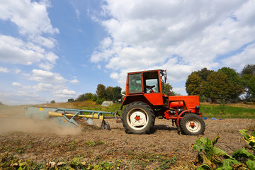 Ternopil region Ukraine, September 2019 Farmer with tractor with special equipment - digging potatoes. The concept of a good harvest.