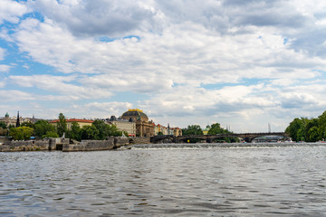 Fototapeta premium Scenic panorama cityscape view of Moldava river boat Prague in Czech Republic.