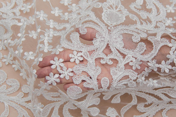Texture lace fabric. lace on white background studio. thin fabric made of yarn or thread. a...