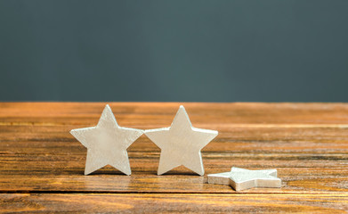 The fall of the third star. The concept of falling rating hotel or restaurant. Deterioration in...