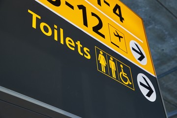 Toilets sign in an airport terminal