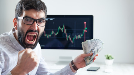 happy man hand money with  working in exchange in office
