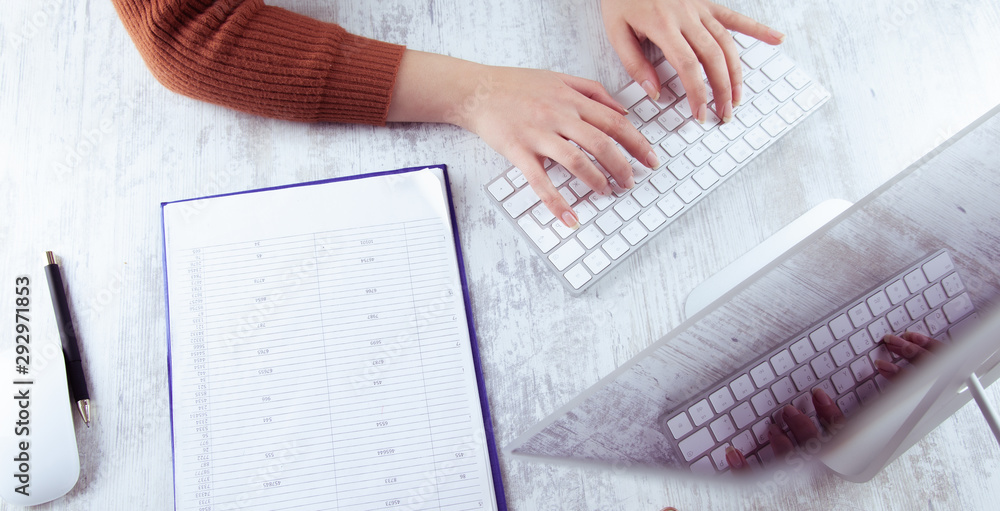Poster woman working in document with computer on desk