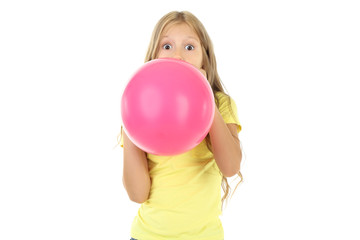 Pretty little girl blowing pink balloon on white background