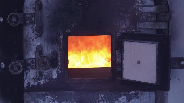 Slow motion fire flame cremate death people burning on dark background.