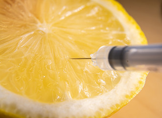 Extracting vitamin C from lemon. Suitable for concepts as Vitamins and flu vaccines for protection...