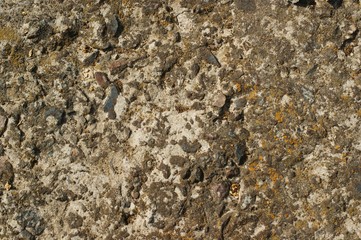 A texture of cracked paint on a concrete wall