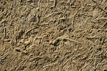 Old wall of a combination of red clay and straw