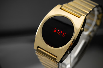 LED gold digital watch vintage retro wristwatch with red display 70s 80s isolated alarm multifunctional chronograph scratched steel used made in usa rare worn watch Armbanduhr golden luxurious side 