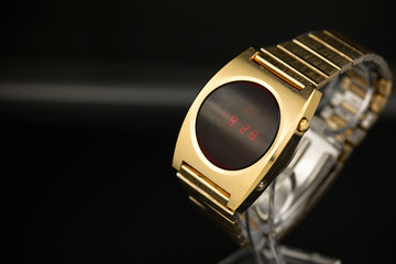LED gold digital watch vintage retro wristwatch with red display 70s 80s isolated alarm...