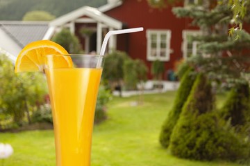 Orange juice glass on background