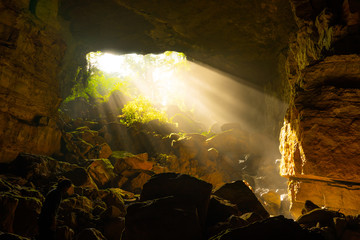The morning light shining inside Pha Phueng Cave, Thailand