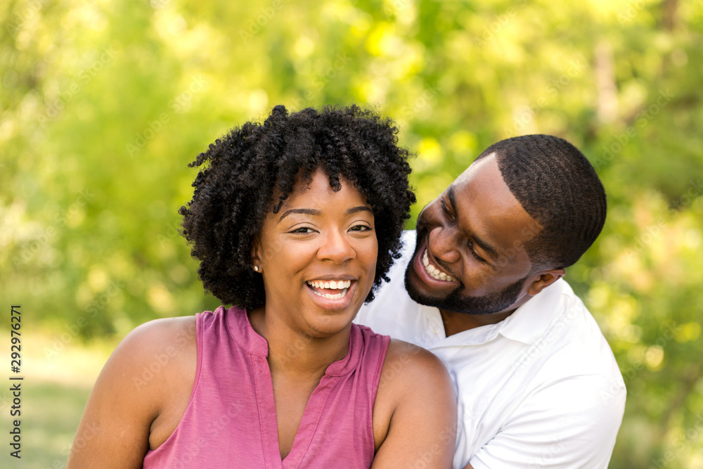 Wall mural happy african american couple laughing and smiling.