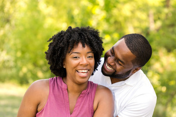 Happy African American couple laughing and smiling.