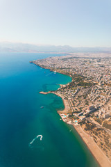 Window view of an airplane on the coast of Antalya with beautiful Taurus Mountains on the horizon, Turkey