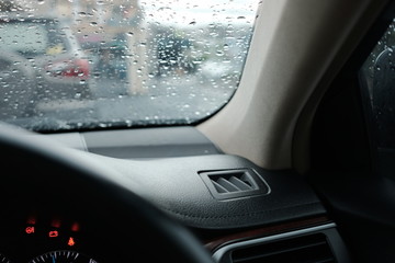 Close up on car panel with raindrops background on raining season