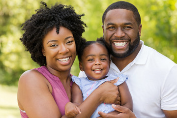 Happy African American family laughing and smiling. - obrazy, fototapety, plakaty