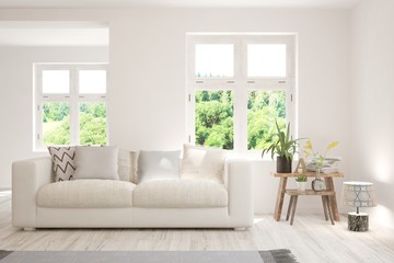 Stylish room in white color with sofa and summer landscape in window. Scandinavian interior design. 3D illustration